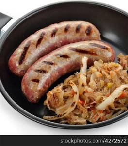 Sausages With Sauerkraut In A Frying Pan