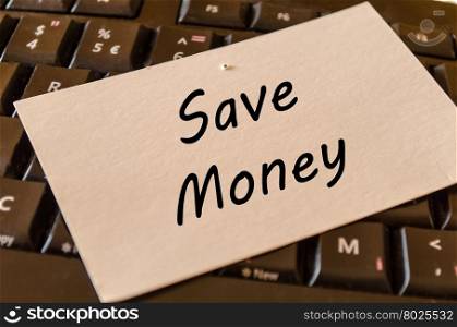 Save money concept on black keyboard background