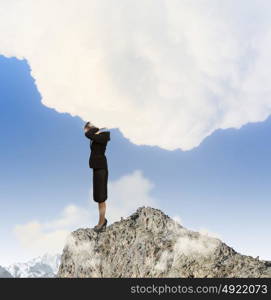 Save planet. Image of businesswoman standing atop of hill