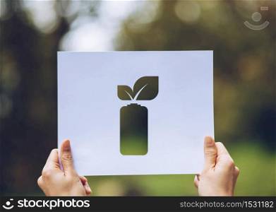 save world ecology concept environmental conservation with hands holding cut out paper leaves battery saving energy showing