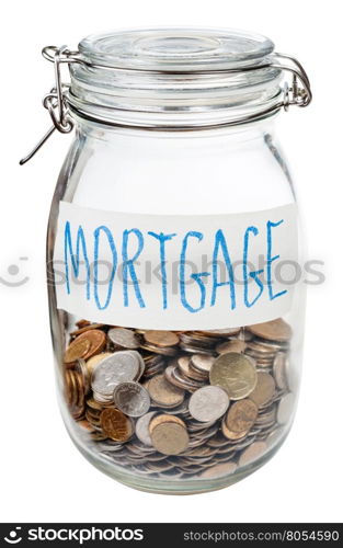 saved coins for mortgage in closed glass jar isolated on white background