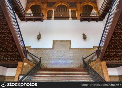 Saville, Spain. Old Spanish Renaissance Revival staircase made of marble and wood.