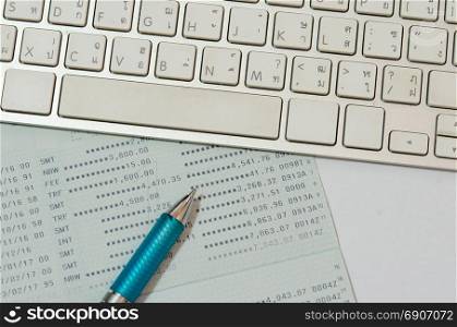 Saving Account Book Bank.Business Finance and keyboard computer with pen.