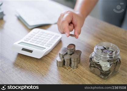 Saving money for Real estate investment with stack of money coins for buy home and loan for prepare in future financial insurance. Accountant verify growing business