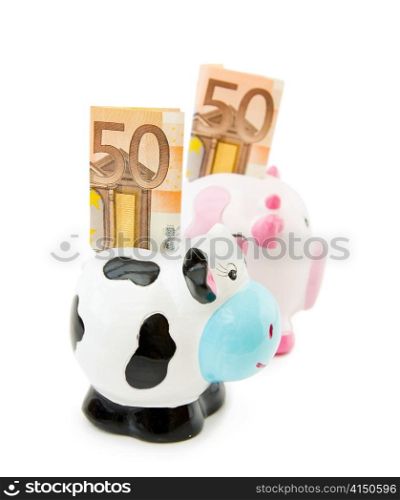 Saving money - piggy and cowie banks