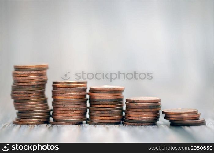 Savings, increasing columns of gold coins coin stack growing money stairs business and financial concept copy space. Savings, increasing columns of gold coins coin stack growing money stairs business and financial concept