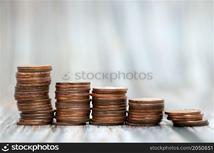 Savings, increasing columns of gold coins coin stack growing money stairs business and financial concept copy space. Savings, increasing columns of gold coins coin stack growing money stairs business and financial concept