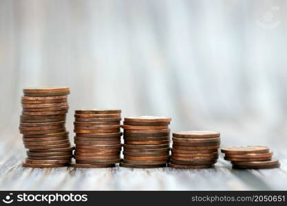 Savings, increasing columns of gold coins coin stack growing money stairs business and financial concept copy space. Savings, increasing columns of gold coins coin stack growing money stairs business and financial concept