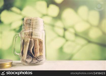 savings jar blurred background