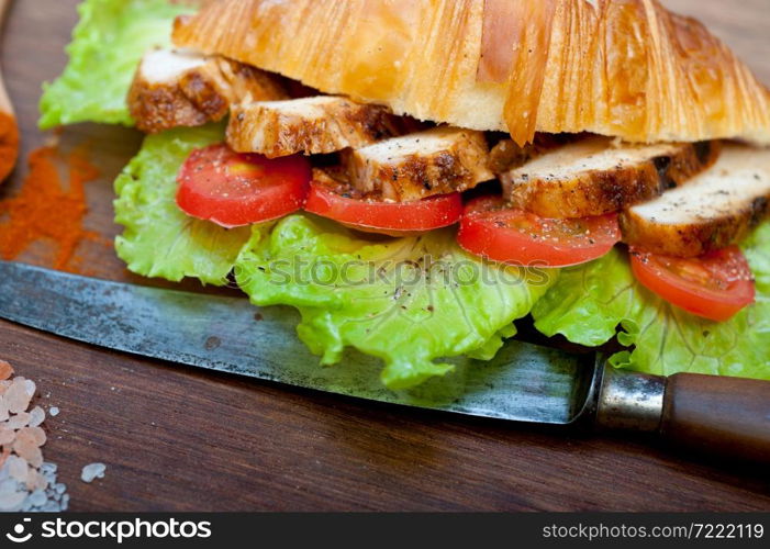 savory croissant brioche bread with chicken breast and vegetable rustic style