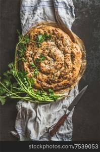 Savory pie with Phyllo dough. Su boregi, burek or borek on dark rustic background. Top view. Turkish cuisine.