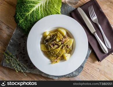 Savoy cabbage stew with potatoes and ground beef.. Savoy cabbage stew with potatoes and ground beef