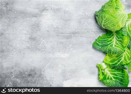 Savoy cabbage whole. On rustic background. Savoy cabbage whole.