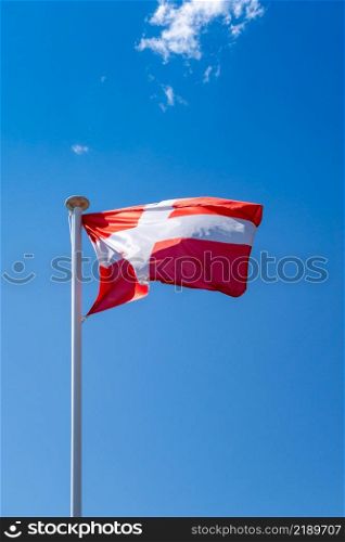 Savoy - Savoie - flag on a blue sky , La Clusaz, France. Savoy - Savoie - flag, La Clusaz, France