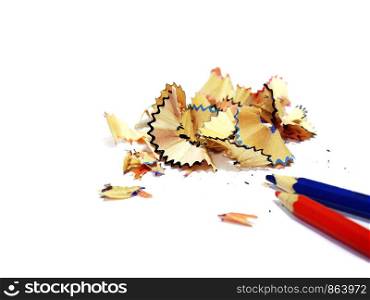 Sawdust shavings of wooden colored pencils from sharpener isolated on a white background, Copy space.