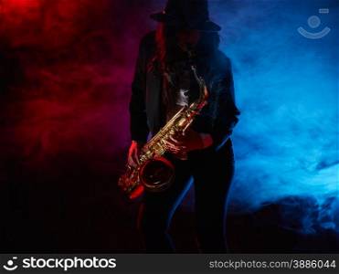 Saxophonist, beautiful young woman, smoky stage on background
