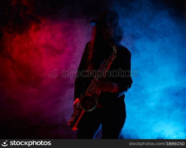 Saxophonist, beautiful young woman, smoky stage on background