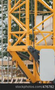 Scaffold of a yellow crane on construction site