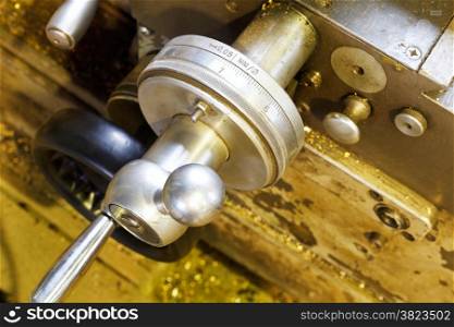 scale handle of carriage of metal lathe machine in turning workshop