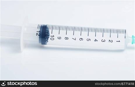 Scale of plastic syringe with solution, studio shot