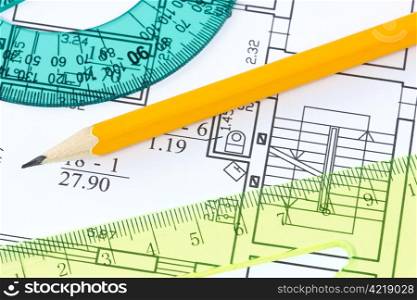 scale rulers and pencil on architectural drawing blueprint