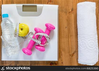 Scales, and sports equipment for active exercises and weight loss plan view of the floor