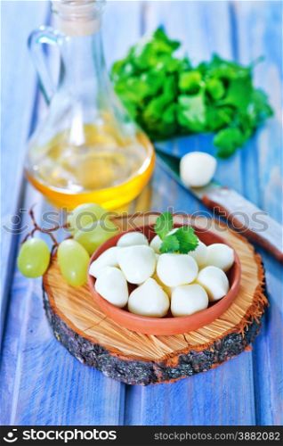 scamorza cheese in bowl and on a table