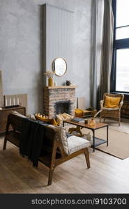 Scandinavian-style interior with fireplace, rattan chair in the trendy colors of 2021 gray and yellow