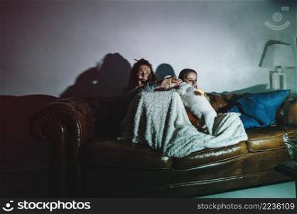 scared kids watching movie with dog