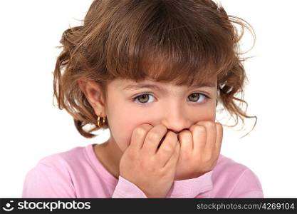 Scared little girl biting nails