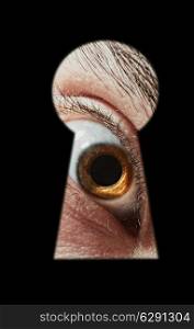 Scared male eye spying through a keyhole macro