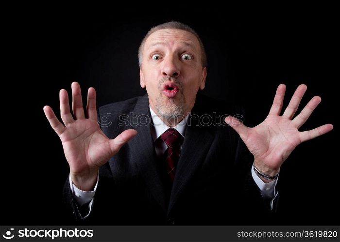 Scared mature businessman looking at camera
