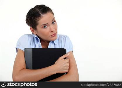 Scared woman hugging folder