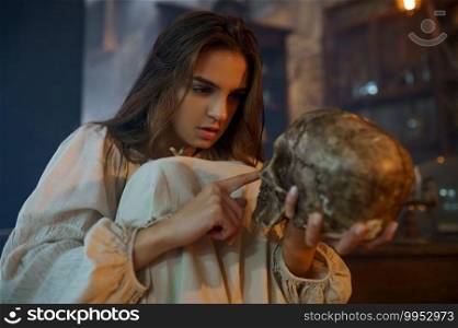 Scary demonic woman holds human skull, demons casting out. Exorcism, mystery paranormal ritual, dark religion, night horror, potions on shelf on background. Scary demonic woman holds human skull, exorcism