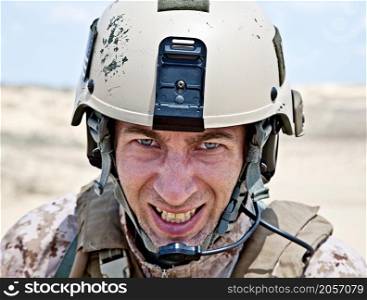 Scary face of US marine in the MARPAT uniform showing teeth
