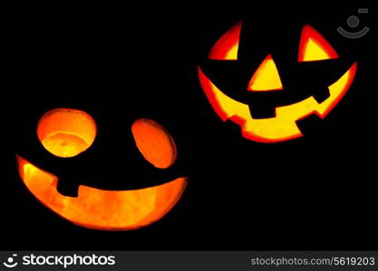 Scary facess of Halloween pumpkins isolated on black background