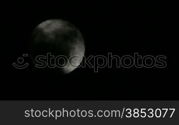 Scary Full Moon in a Cloudy Night.Very detailed lunar surface with its valleys and craters.Suitable for fear, scary and terror scenes.Awesome full moon. Night of wolf, Halloween night, nightmare.