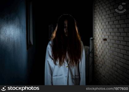 Scary ghost in white dress halloween theme