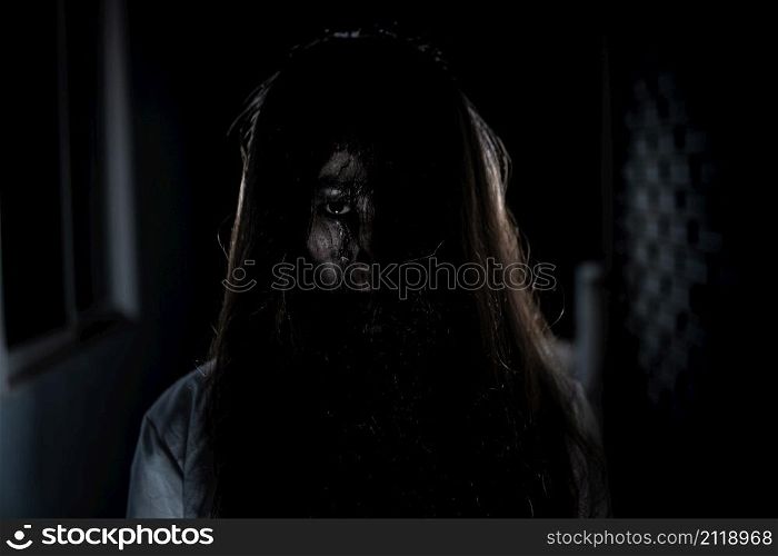 Scary ghost in white dress halloween theme
