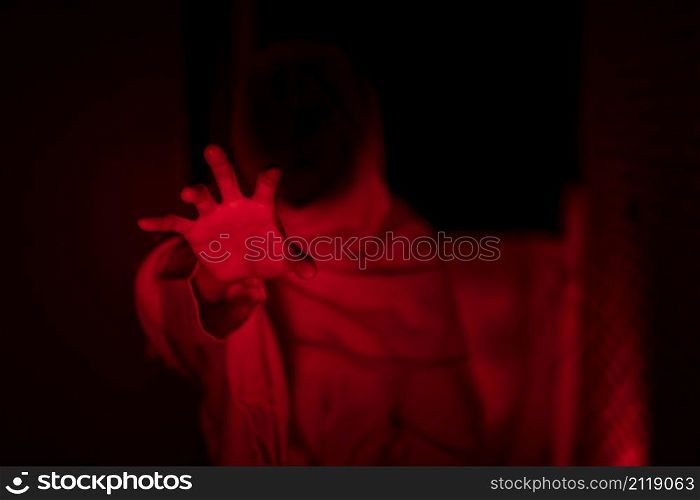 Scary ghost in white dress halloween theme red tone
