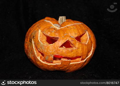 Scary Halloween pumpkin on a black background