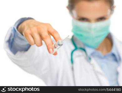 Scary medical doctor woman in mask using syringe