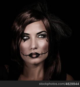Scary woman portrait isolated on black background, mystery night, terrifying makeup, spooky zombie, young witch, Halloween party concept