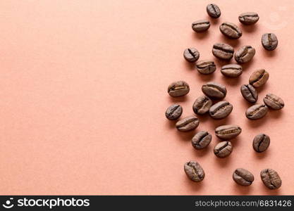 Scattered coffee beans. Heap of roasted brown coffee beans with copy space