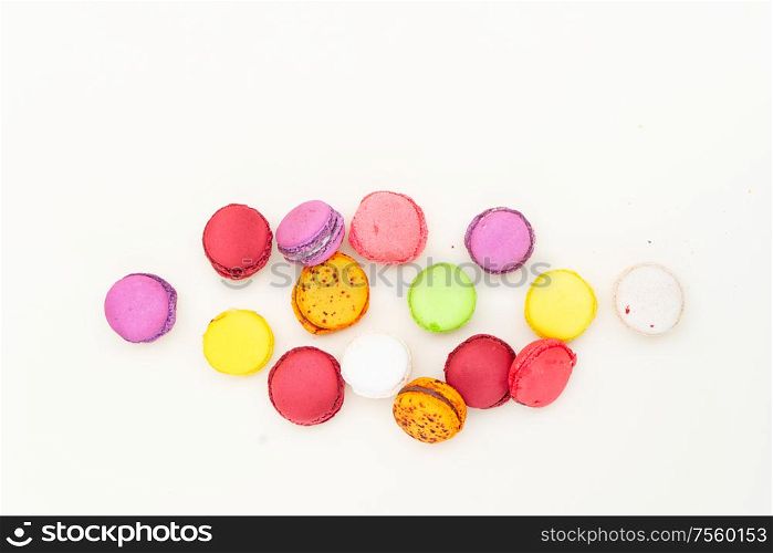 Scattered fresh macaroon biscuit, top view flat lay. Fresh macaroon confection