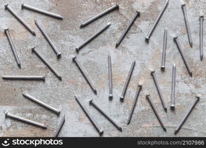 scattered nails grunge wooden desk