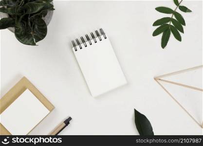 scattered office supplies leaves table