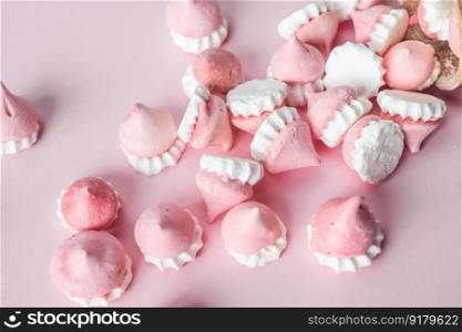 Scattered pink and white decor for baking, meringue , a place to advertise a pastry chef. Scattered pink and white decor for baking, meringue in waffle cookies, a place for advertising