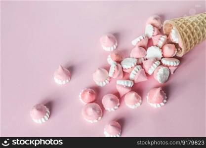 Scattered pink and white decor for baking, meringue , advertising space. Scattered pink and white decor for baking, meringue in waffle cookies