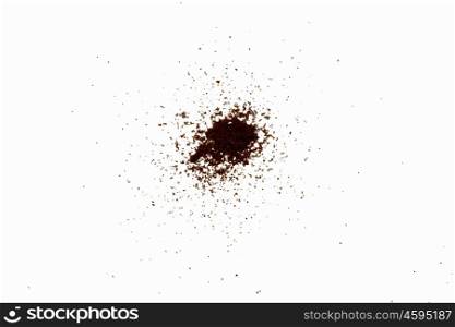 Scattered powder. Abstract image with brown powder on white background